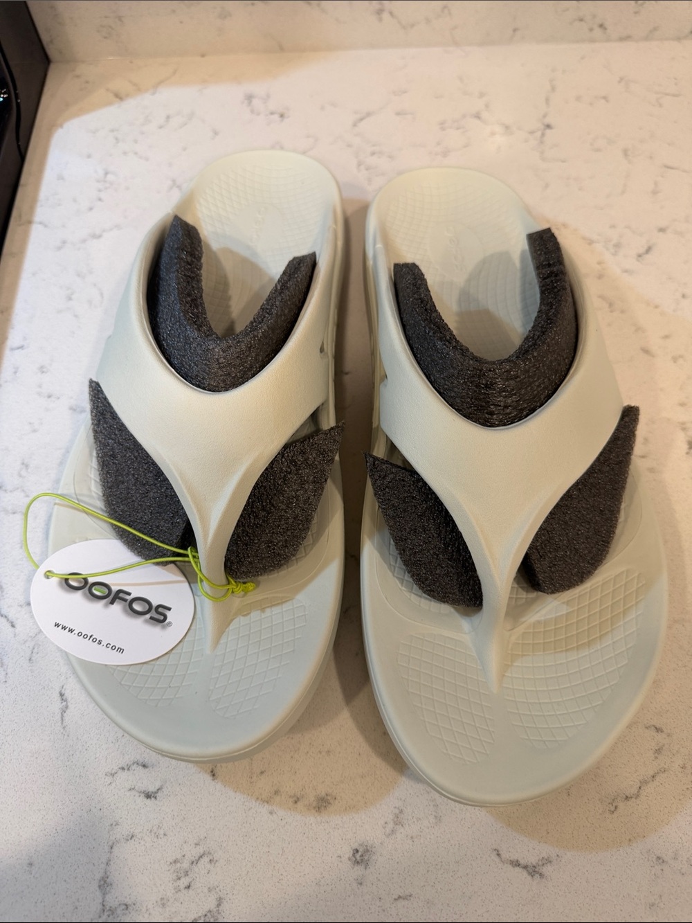 OOFOS Lightweight Recovery Flip Sandals in Pale Mint and Charcoal